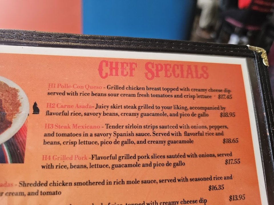 Menu layout with house specialties and sides.